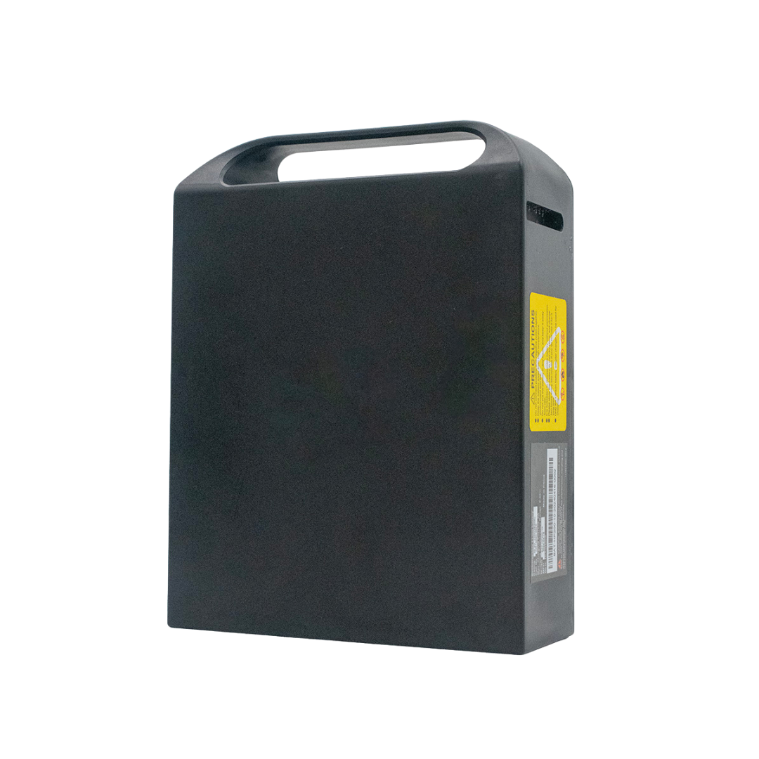 A rectangular black travel battery with a built-in handle and yellow warning labels, designed as an accessory for the Pride Jazzy® Ultra Light Powerchair, is shown against a white background.